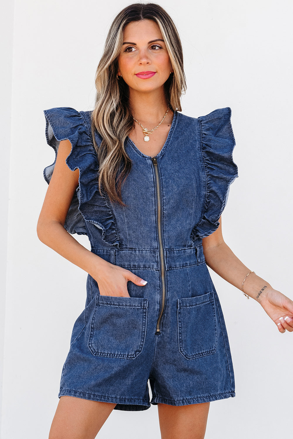Lavendar Lane Blue denim romper with ruffled front zipper and belt, stylish jumpsuit for casual or summer wear.