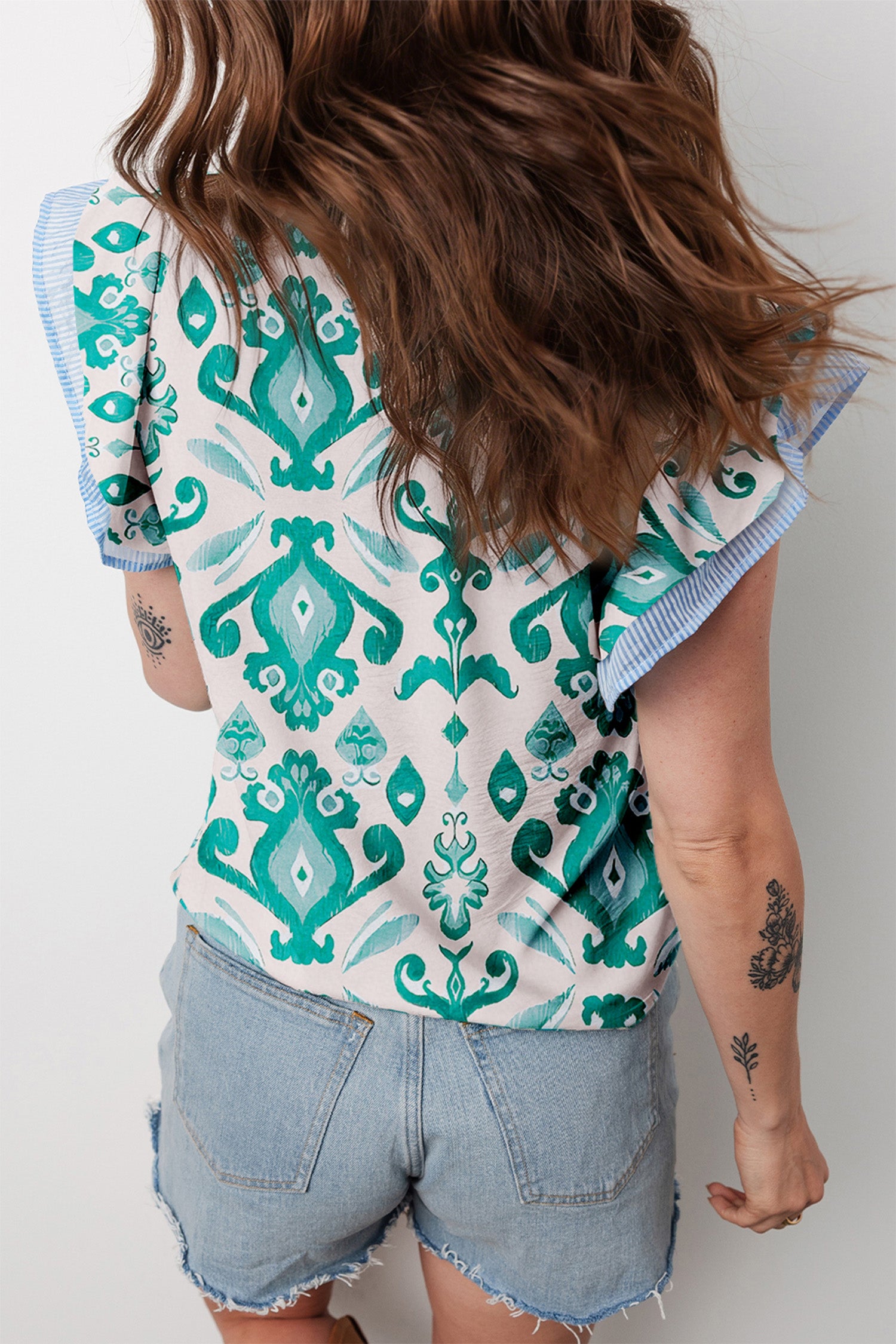 Sky blue ethnic print striped trim flutter sleeve top by Lavendar Lane Clothing, featuring a relaxed fit and vibrant design.