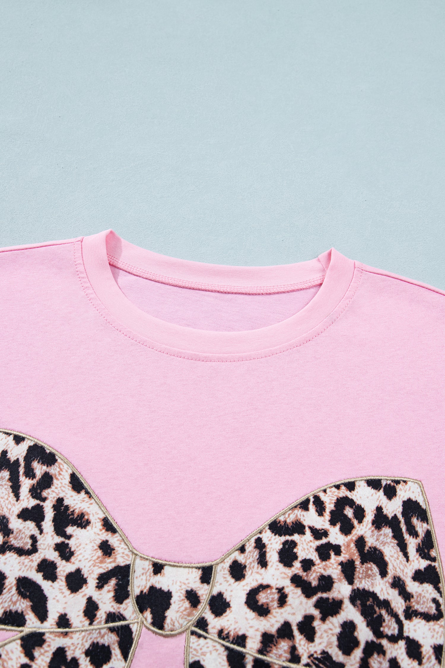 Pink leopard embroidered cotton round neck T-shirt by Lavendar Lane Clothing featuring a bow detail and casual style.