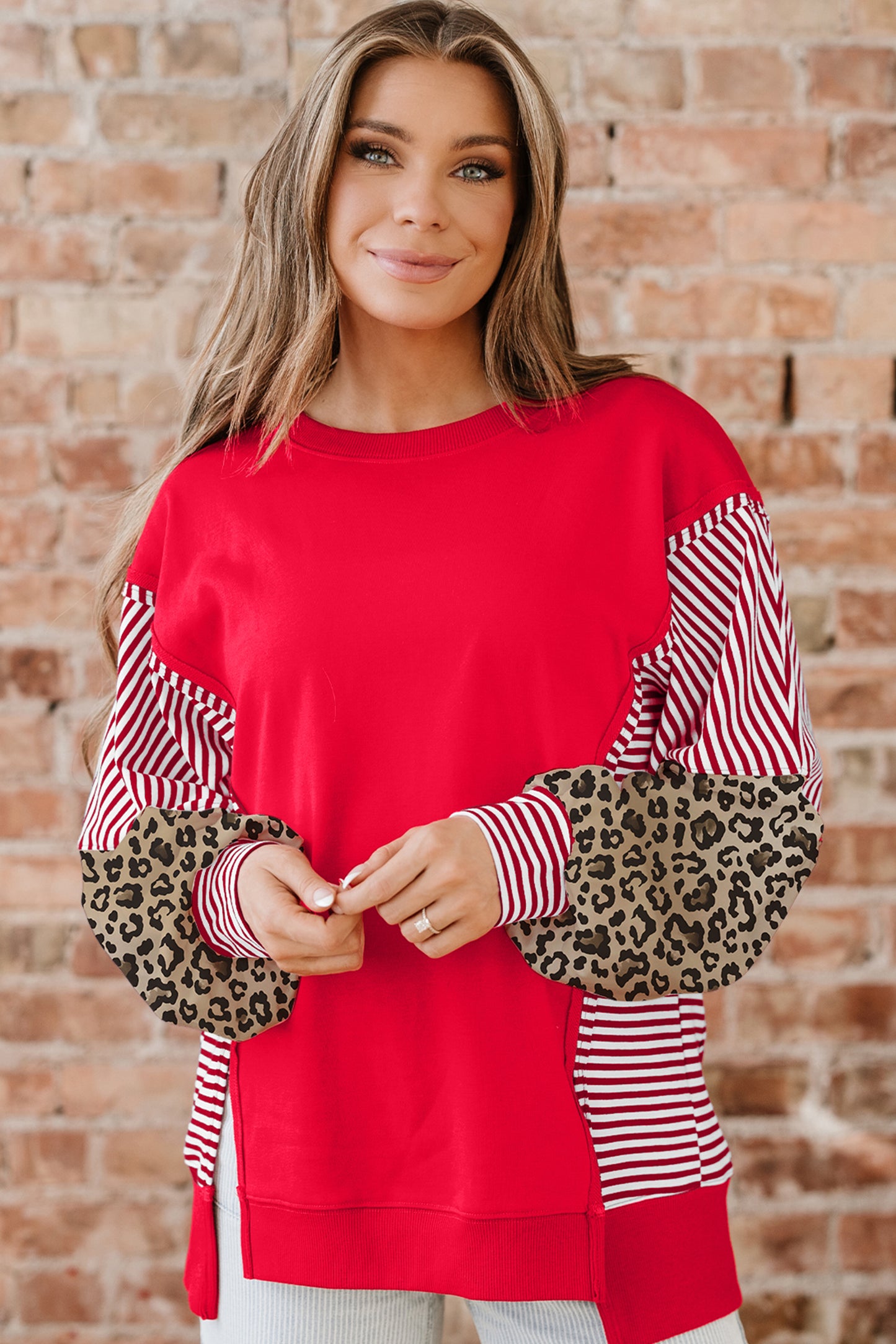 Racing Red striped patchwork sleeve colorblock top by Lavendar Lane Clothing, featuring bold red, black, and white color accents.