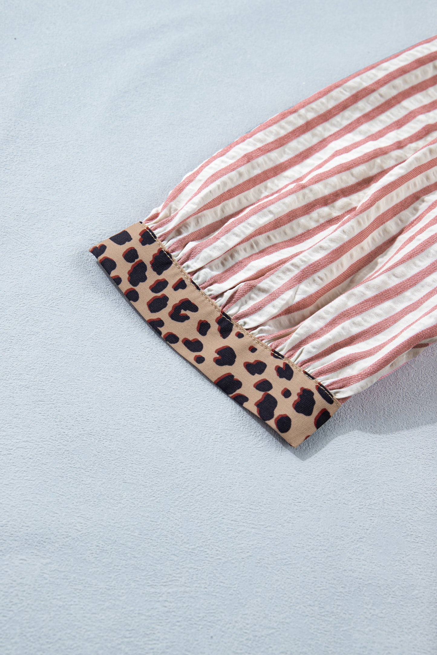 Pink stripe leopard trim V-neck button-down blouse from Lavender Lane Clothing, half sleeves and stylish design.