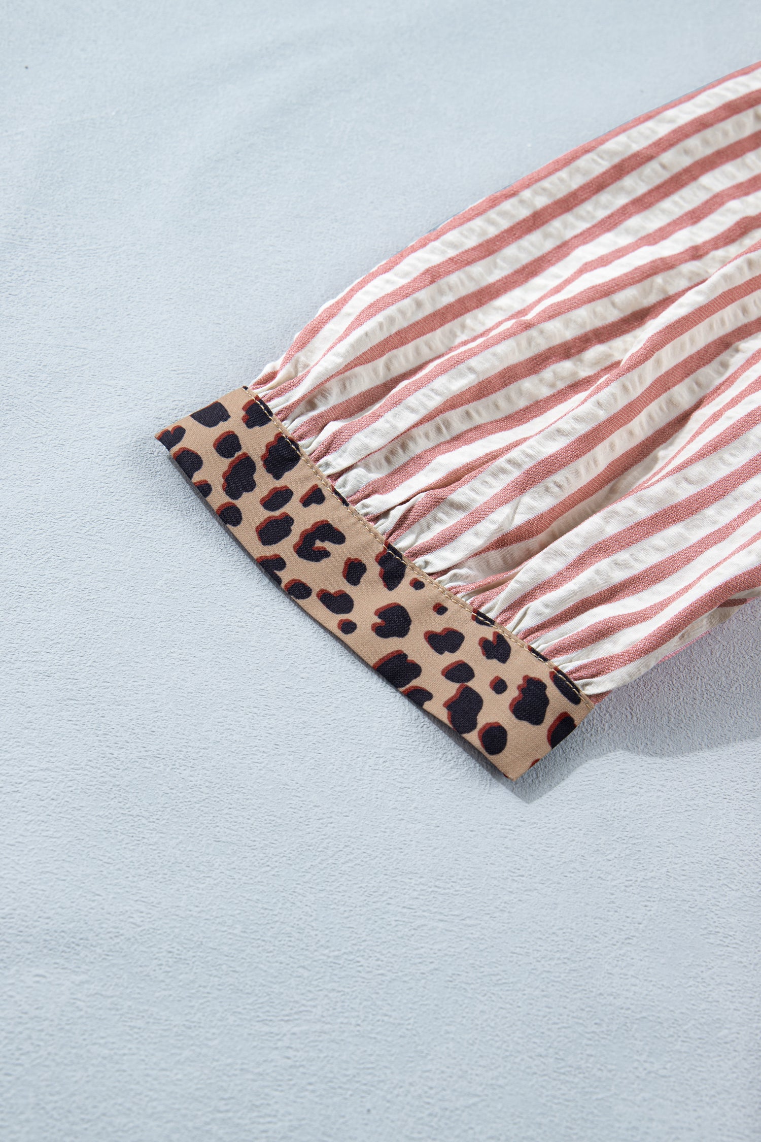 Pink stripe leopard trim V-neck button-down blouse from Lavender Lane Clothing, half sleeves and stylish design.